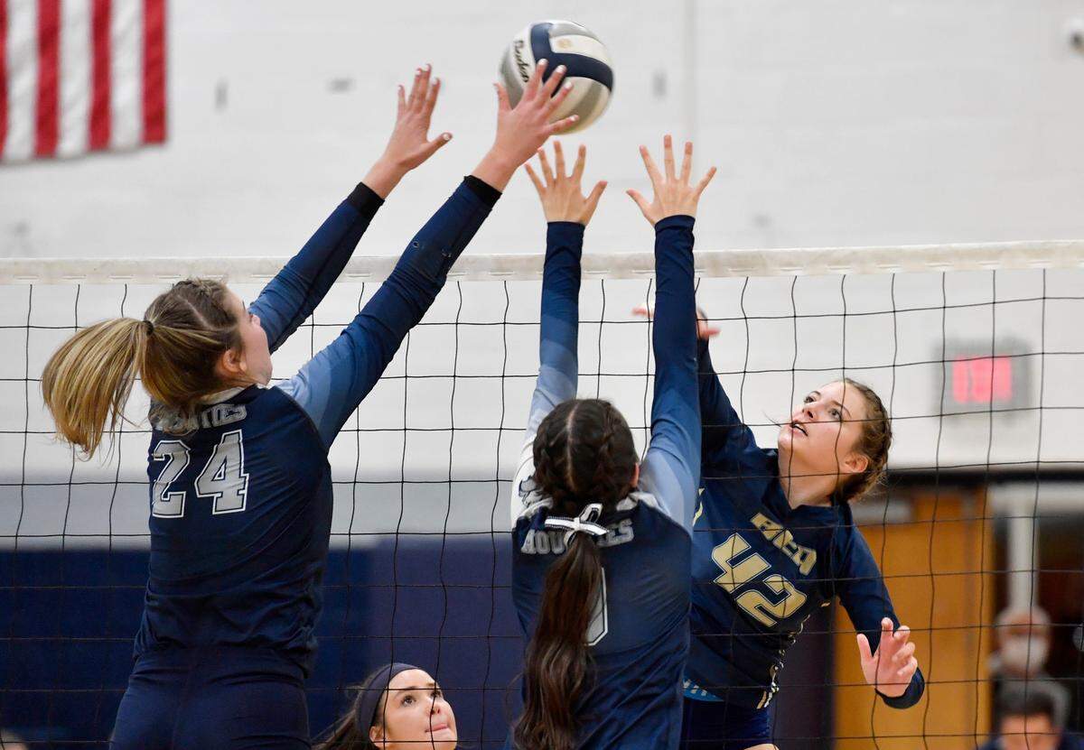 Philipsburg-Ocseola’s Reese Hazelton and Abby Lumadue jump to block the hit from Bald Eagle Area’s 42 during the District 6 2A semi-final game on Thursday, Nov. 4, 2021.