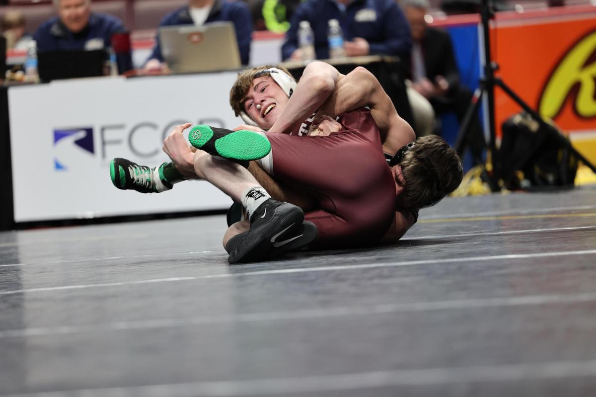 State College’s Asher Cunningham scrambles with Central Dauphin’s Matt Repos in their 145-pound consolation finals match of the PIAA Class 3A Championships on Saturday, March 11, 2023 at the Giant Center in Hershey. Repos edged Cunningham, 1-0.