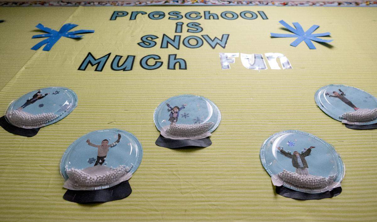 Snowglobes featuring the students hang on a bulletin board at Bellefonte Playschool on Tuesday, Feb. 21, 2023.