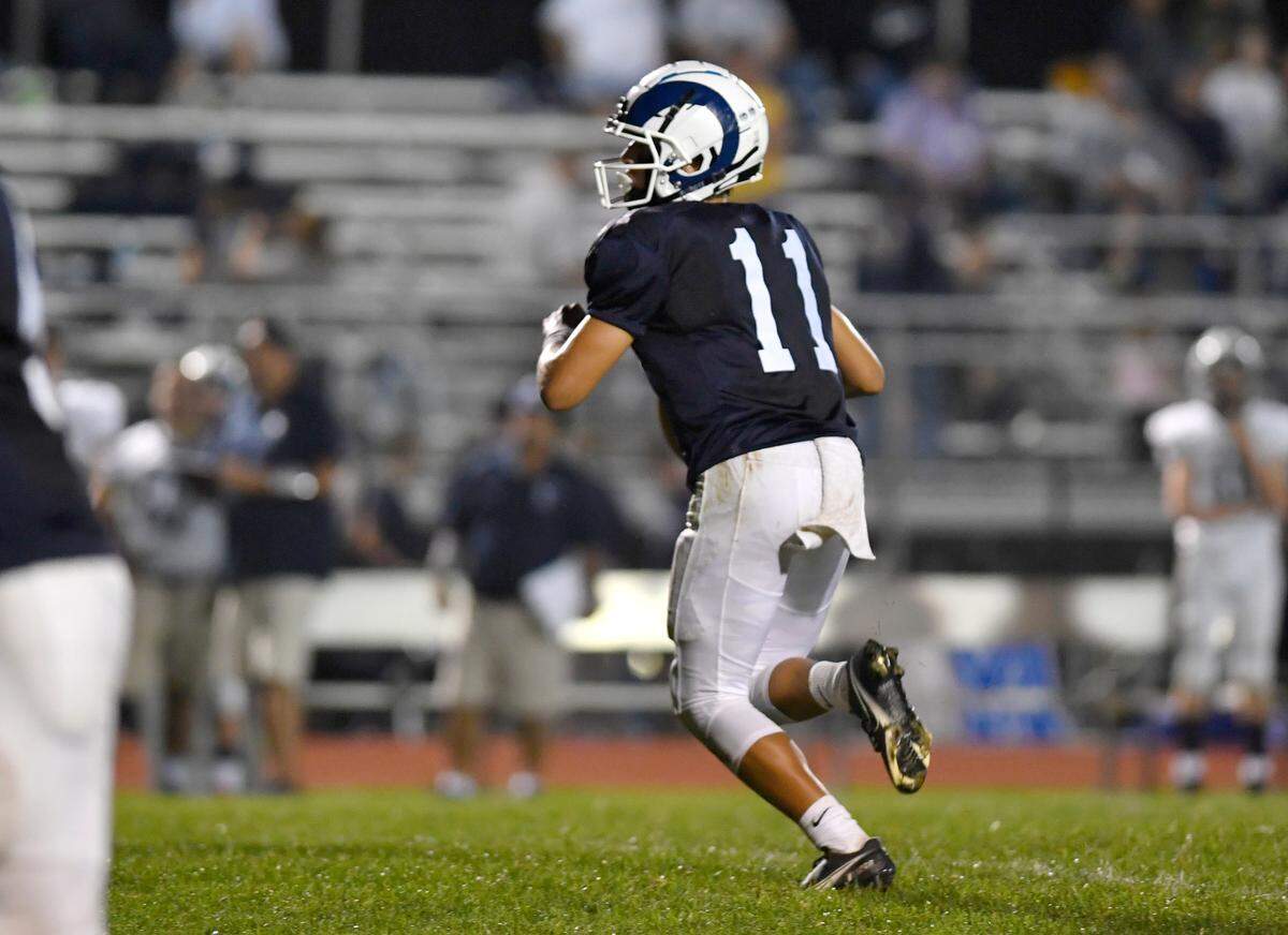 Penns Valley quarterback Jackson Romig drops back to make a pass during the game against Philipsburg-Osceola on Friday, Sept. 17, 2021.