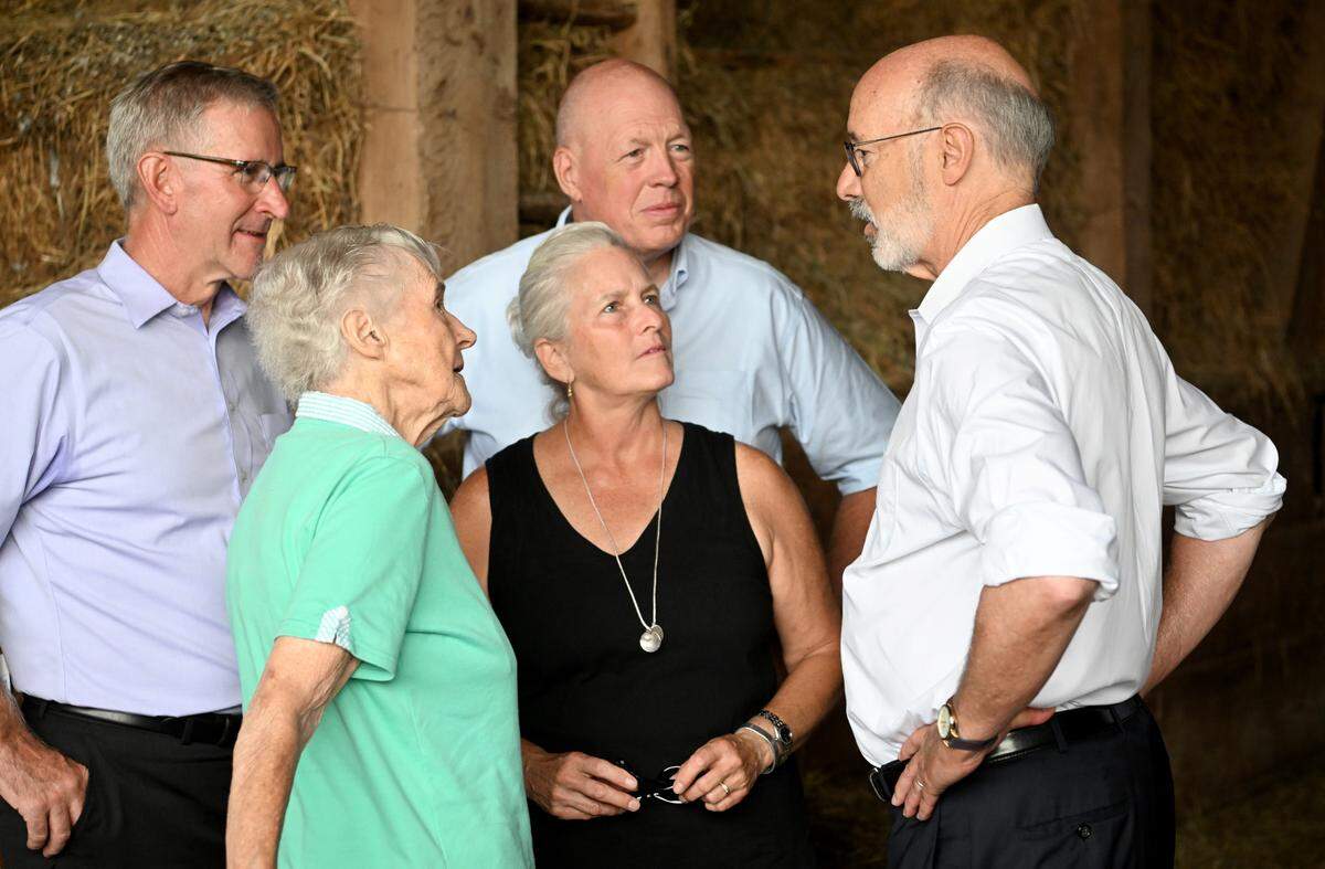 Pennsylvania Gov. Tom Wolf chats with the Harding family, Janet, Cindy and Jeff, and Agriculture Secretary Russell Redding during a visit to Harding Beef Farm in State College on Thursday, Aug. 4, 2022.