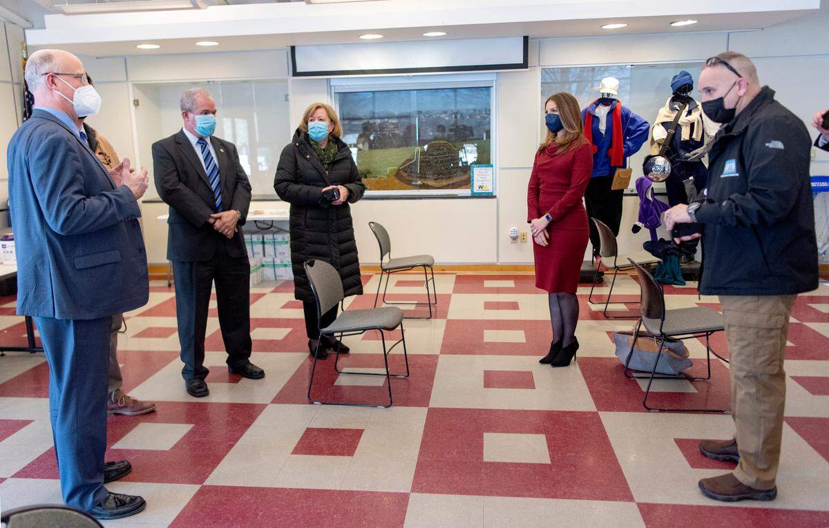 Acting Secretary of Health Keara Klinepeter chats Wednesday with county commissioners during a visit to the AMI Centre County COVID-19 testing site.