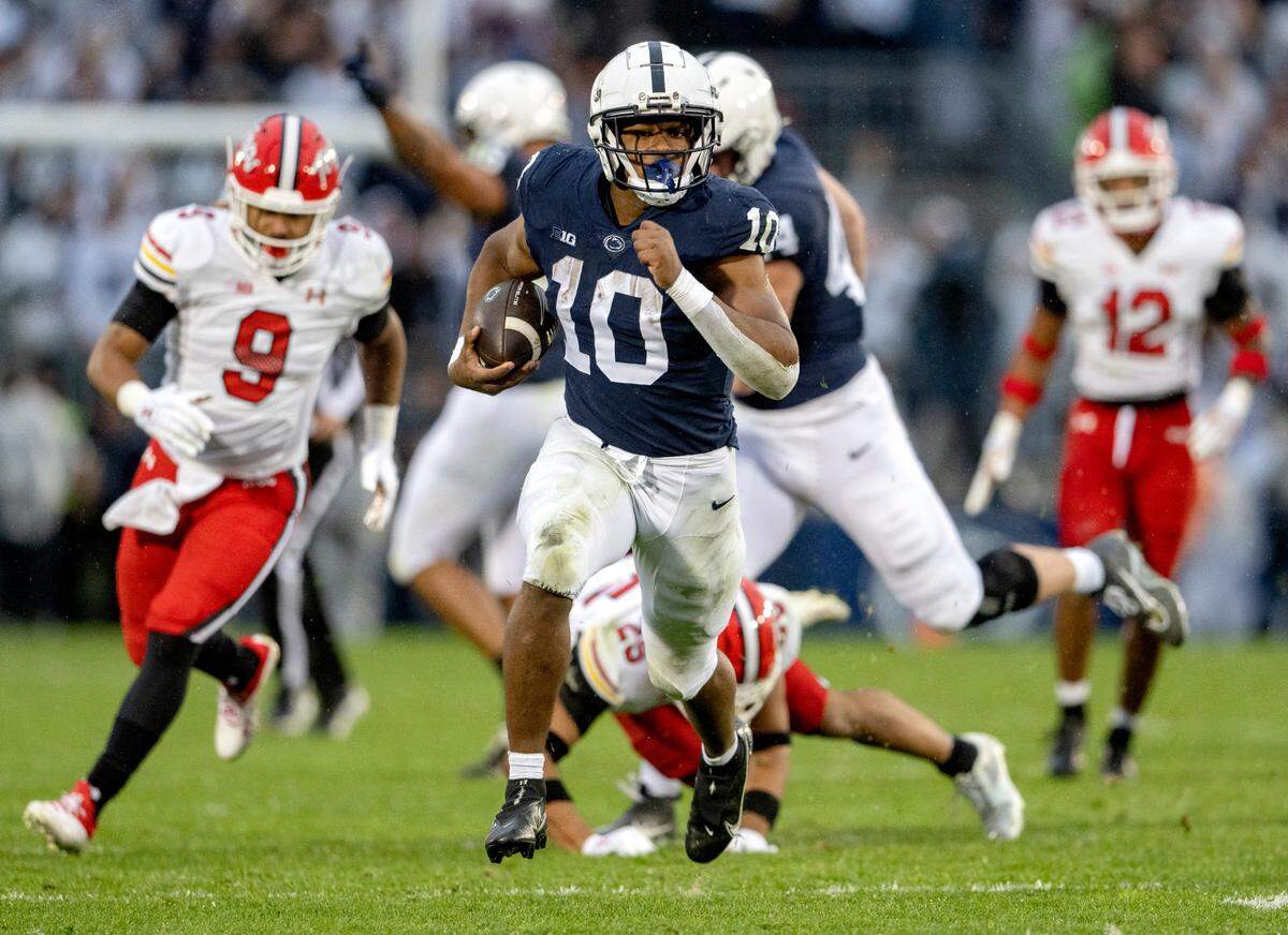 Penn State running back Nick Singleton cuts down the field from Maryland defenders for a touchdown during the game on Saturday, Nov. 12, 2022.