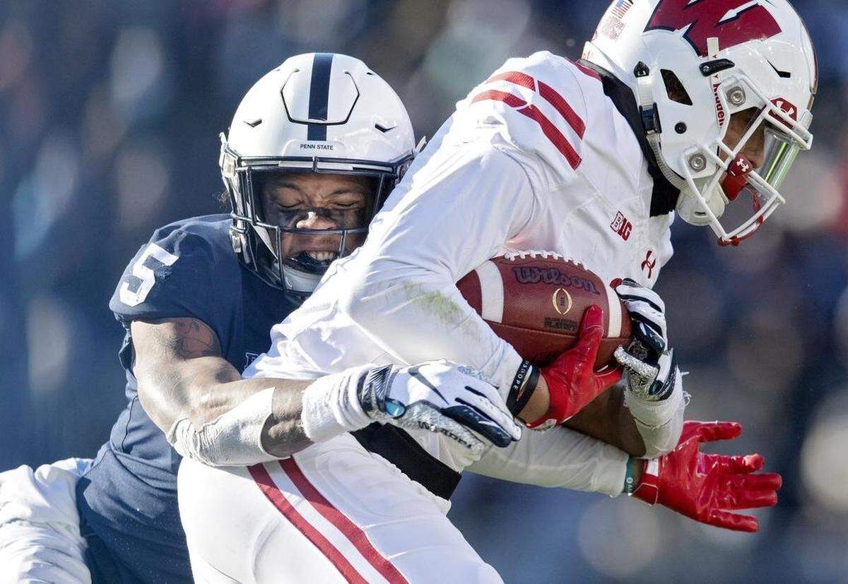 Penn State cornerback Tariq Castro-Fields pulls down Wisconsin’s Danny Davis during the game on Saturday, Nov. 10, 2018.