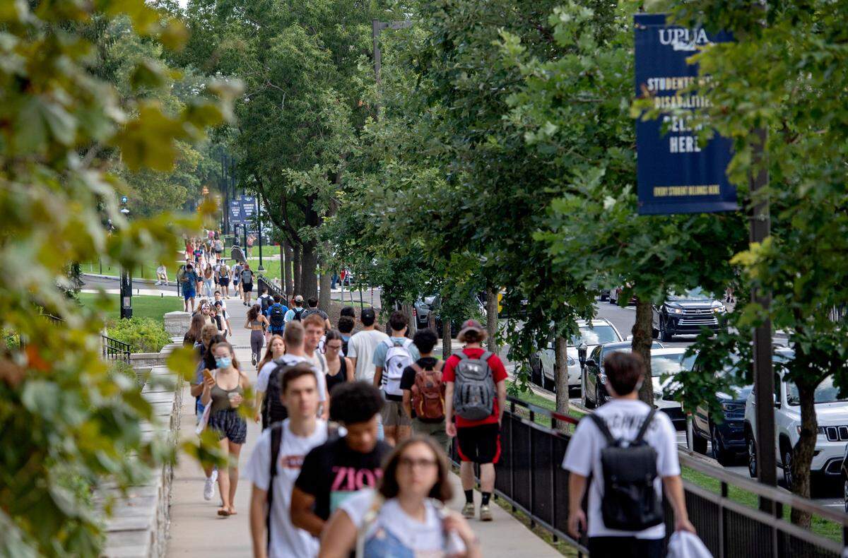 Penn State students walk on campus on the first day of classes on Monday, Aug. 23, 2021.