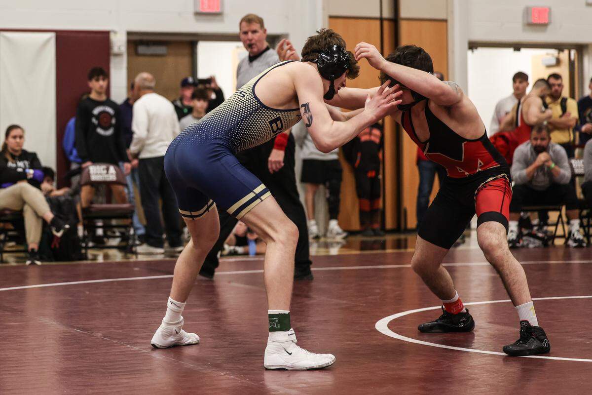 Bald Eagle Area’s Caden Judice hand fights with Bishop McCort’s Bo Bassett in their 145-pound championship match of the PIAA Class 2A Southwest Regional Championships on Saturday, Feb. 28, 2026 in Altoona. Bassett beat Judice, 21-6.