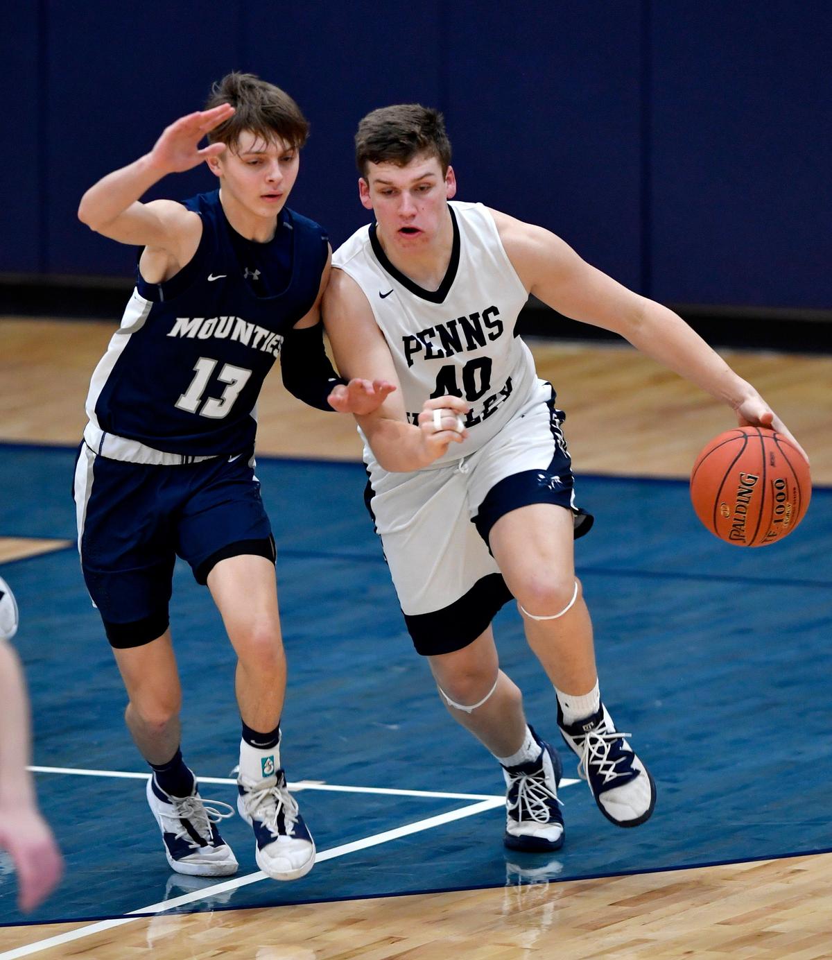 Penns Valley’s Logan Snyder dribbles around Philipsburg-Osceola’s Jacob De Simone during the game on Wednesday, Jan. 15, 2020.