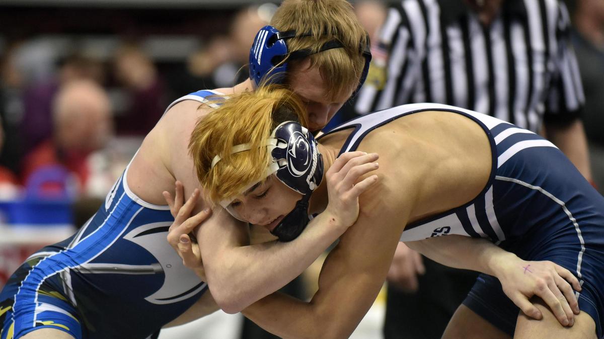 Philipsburg-Osceola’s Chase Chapman, right, opened his Class 2A PIAA Wrestling Championships with a 10-8 win Thursday over Northern Lebanon’s Collin Leonard at 132 pounds in Hershey’s Giant Center. Chapman will next take on Cambridge Springs’ Tye Varndell in Friday’s quarterfinals.