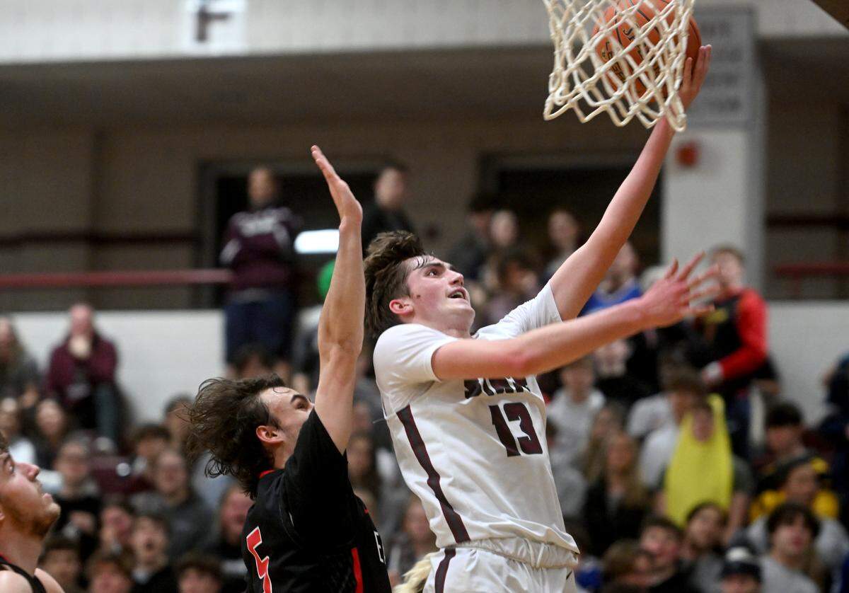Cumberland Valley defenders can’t stop State College’s Ryan Perks as he gets a basket during the game on Tuesday, Feb. 7, 2023.