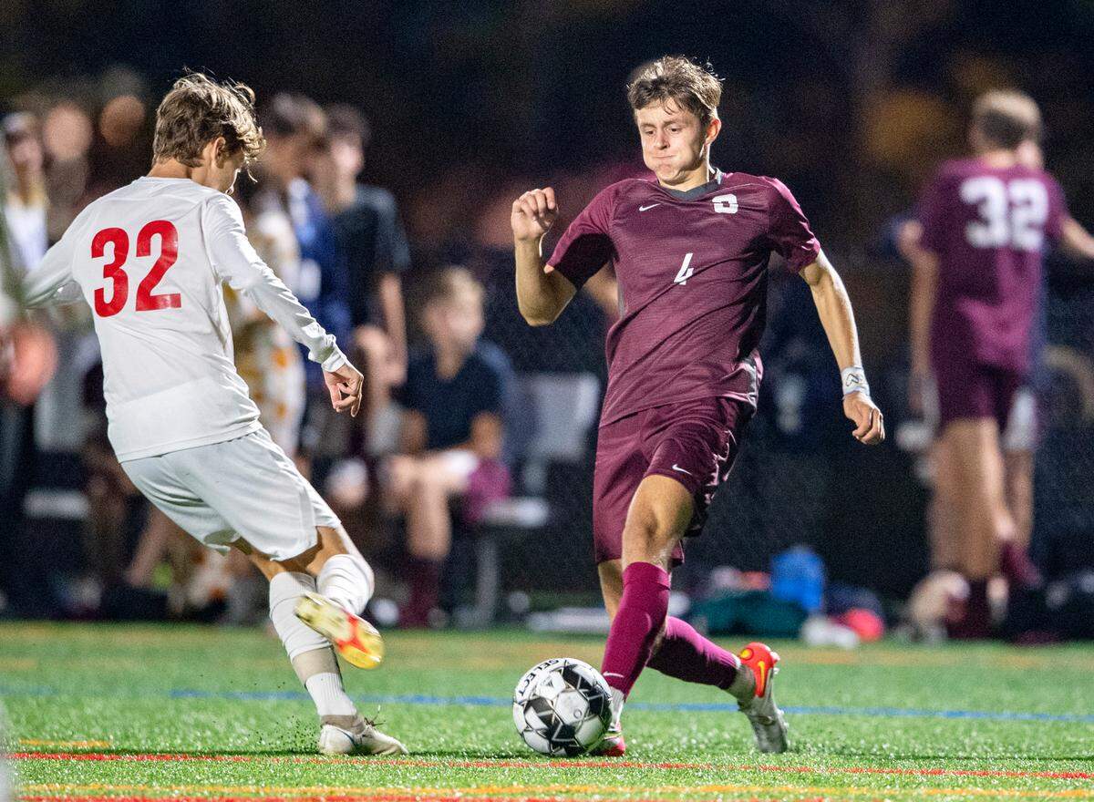 State College’s Quinn Murphy dribbles around a Red Land defender during the game on Wednesday, Oct. 13, 2021.