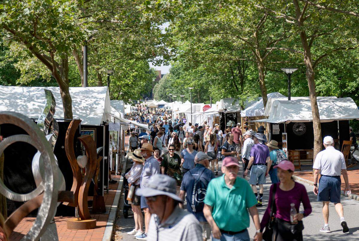 Visitors browse the artists along Pollock Road during the Central Pennsylvania Festival of the Arts on Friday, July 11, 2025.