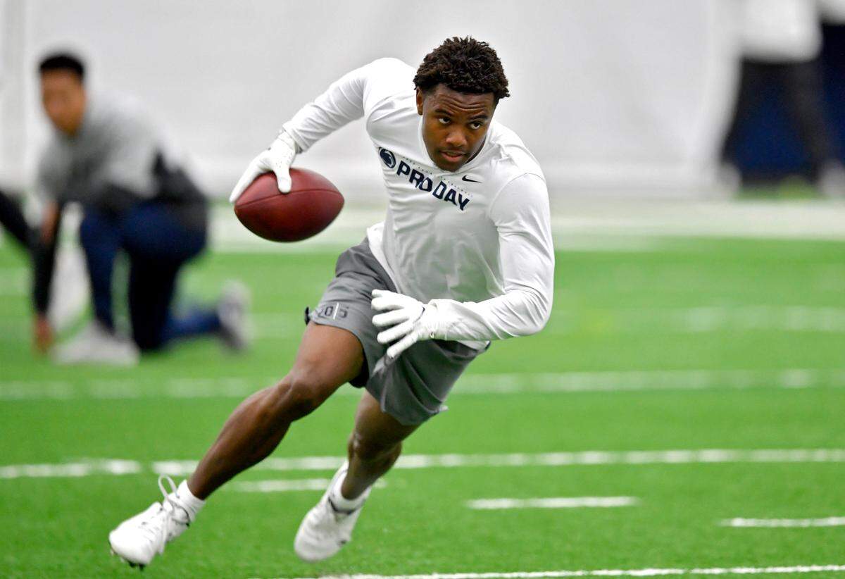 Wide receiver Jahan Dotson makes a catch and turns to run down the field during Penn State pro day on Thursday, March 24, 2022.