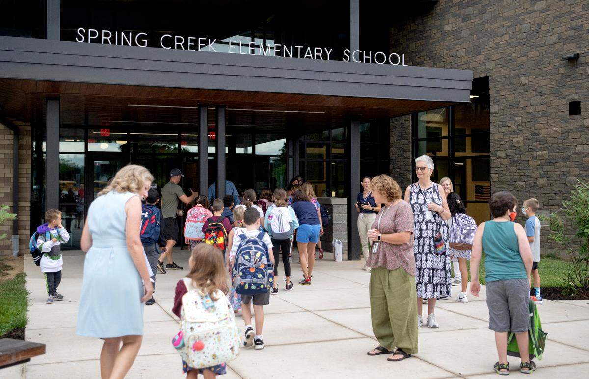 Students arrive at Spring Creek Elementary for the first day of school on Tuesday, Aug. 23, 2022.