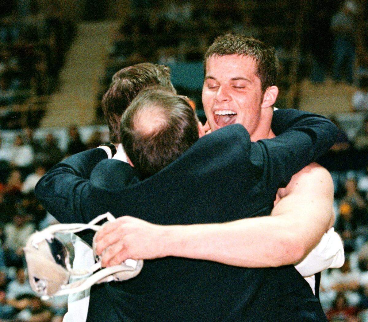 Philipsburg-Osceola’s Jon Condo celebrates his 3-2 AAA 275-pound semi-final win over Clearfield’s Tim Taylor with his coaches on Saturday, March 11, 2000. Later in the day, Condo defeated Adam LoPiccolo of Susquehanna, 6-5, to win the title. CDT photo Craig Houtz