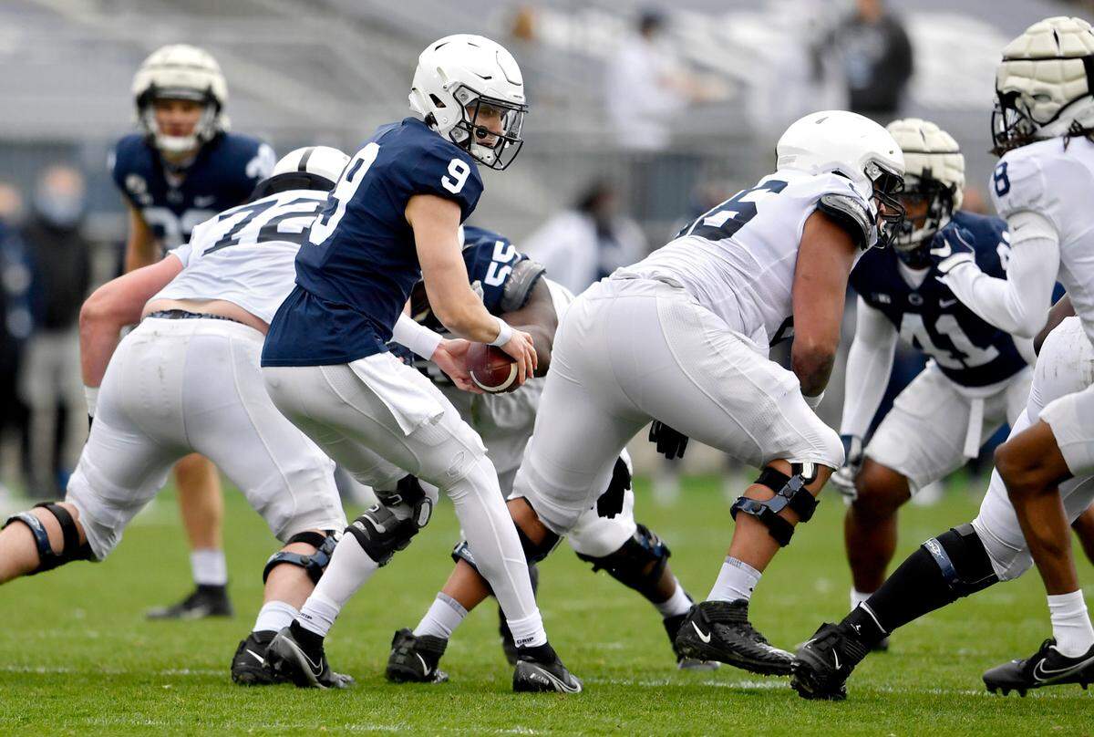 Penn State true freshman quarterback Christian Veilleux takes a snap during spring practice on Saturday, April 17, 2021 at Beaver Stadium.