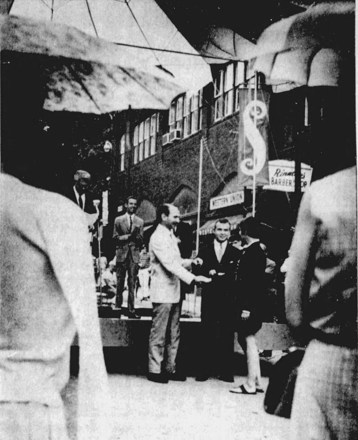 Umbrellas sprout over the audience at the awards ceremony at the first-ever Central Pennsylvania Festival of the Arts in July 1967.