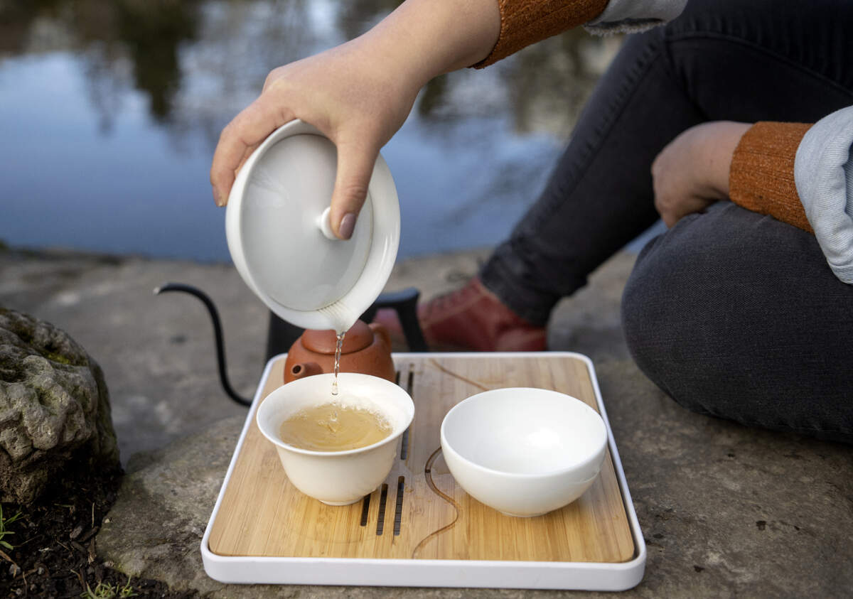 Joyce Yong of Thunder Thunder Tea pours a cup of jasmine tea on Tuesday, Jan. 31, 2023.