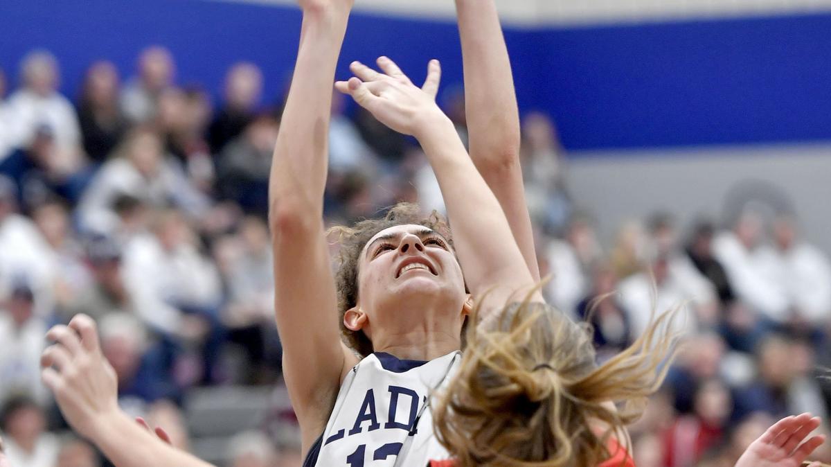 Central’s Bailey Heuston tries to block Penns Valley’s Isabella Culver as she shots for a basket during the District 6 3A quarterfinal game on Friday, Feb. 22, 2019.