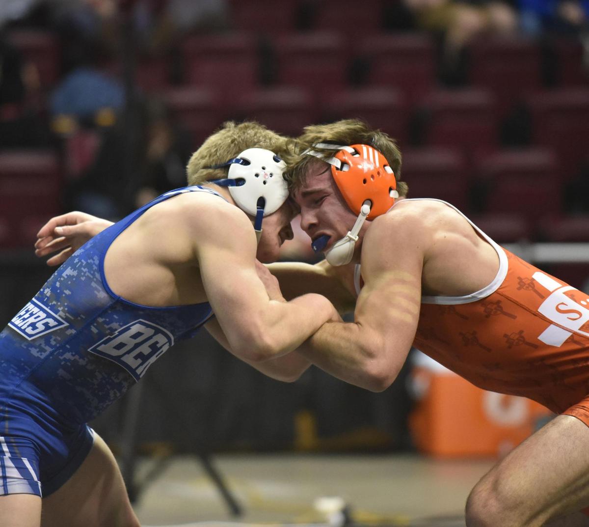 St. Joseph’s Catholic Academy’s Caleb Dowling, right, has the fastest fall this season after pinning Bloomsburg’s Jesse James, not pictured) in seven seconds. Dowling has three fall times in the top-10 this year.