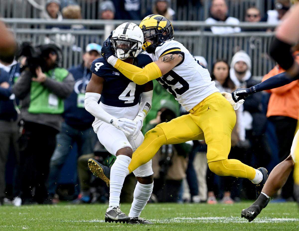 Penn State cornerback Kalen King gets called for pass interference when Michigan’s AJ Barner gets wrapped up around him during the game against Michigan on Saturday, Nov. 11, 2023.