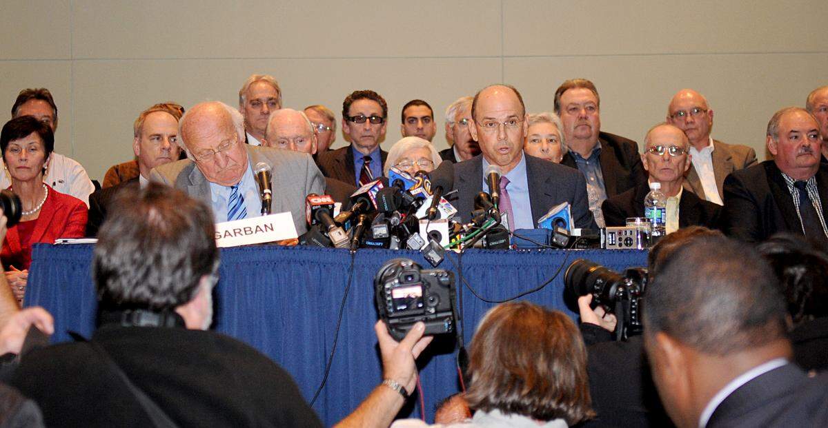 Board of trustees member John Surma announces that both head football coach Joe Paterno and President Graham Spanier were removed from their respective positions during a press conference at the Penn Stater Hotel and Conference Center on Wednesday, November 9, 2011.