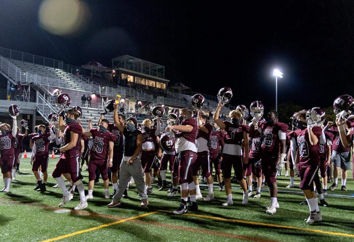 The State College football team sings the alma mater after the win over Cumberland Valley on Friday, Oct. 9, 2020.
