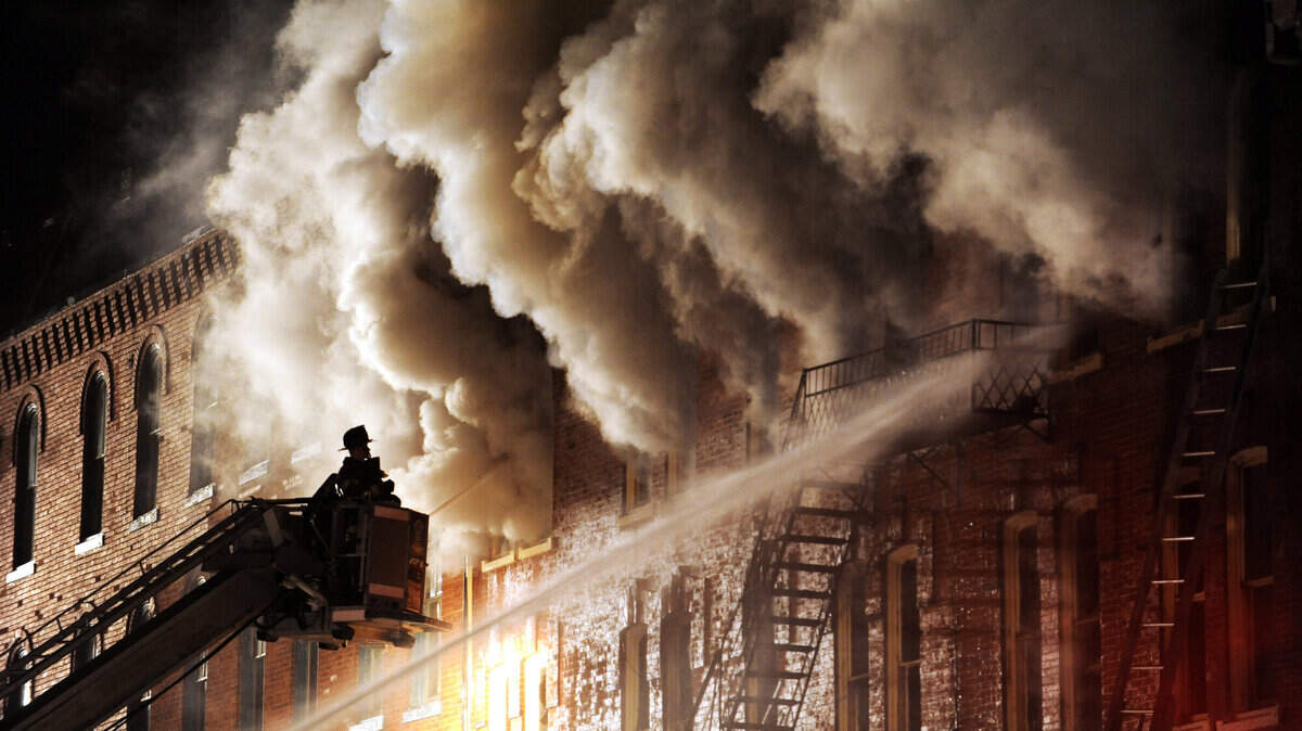 Firefighters sprays water on the blaze inside the Dode Hotel building, along East High St., in Bellefonte, Pa., Sunday, September 9, 2012.  The fire started just before midnight Saturday and continued through the night.  The Dode hotel is across the street from the Centre County Courthouse.