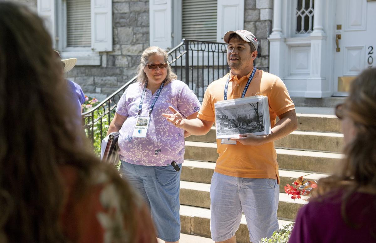 Bellefonte teacher Matt Maris introduces a group to the Bellefonte Walking Tour outside of the Centre County Library and Historical Museum on Friday.