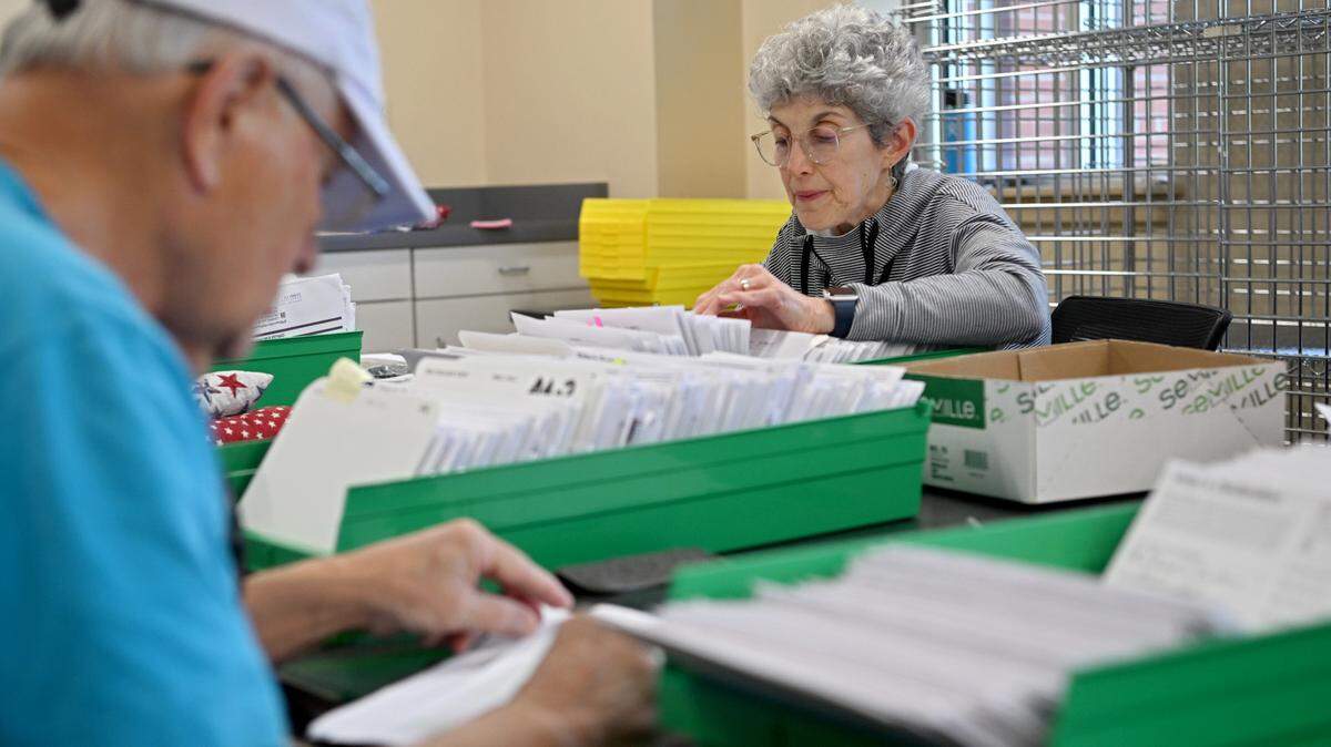 Laura Brown and fellow election office volunteers sort mail-in ballots at the Willowbank Building in Bellefonte May 15, 2023. Just how many Pennsylvanians may vote by mail in the Tuesday, Nov. 5 presidential election?