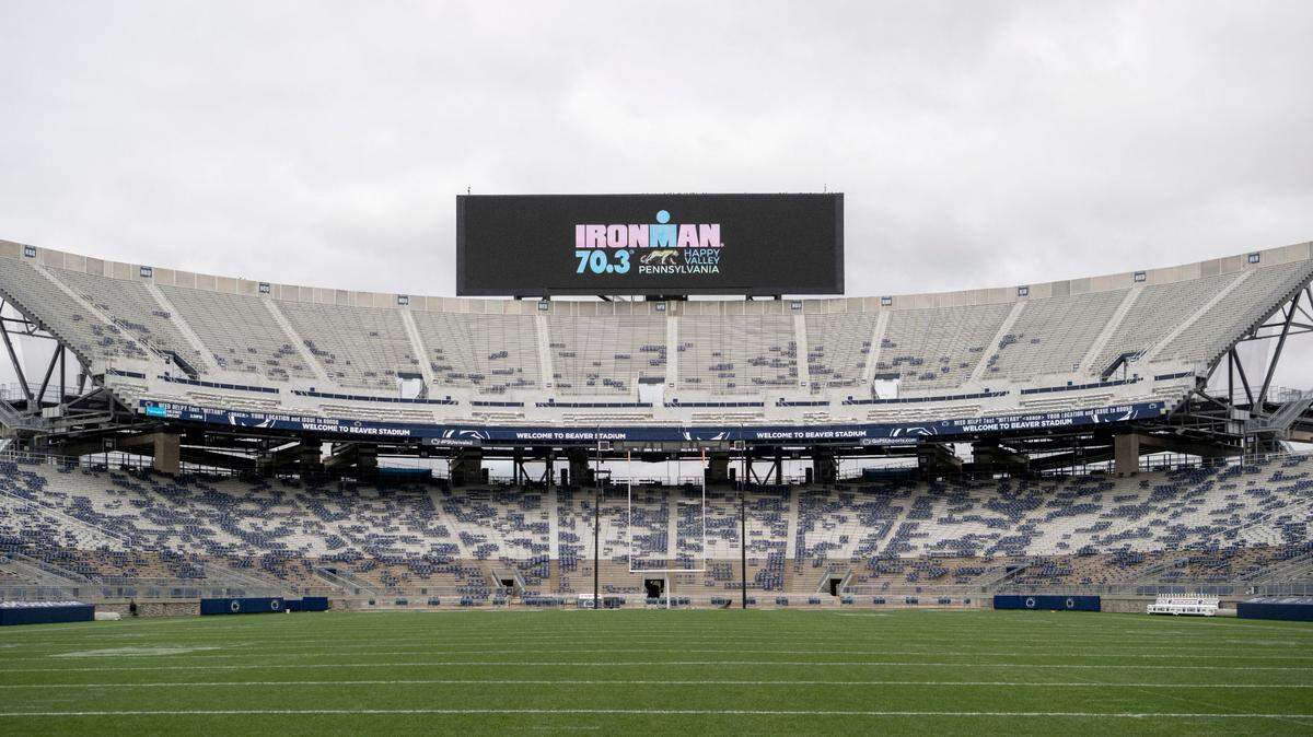 The scoreboard at Beaver Stadium promotes the Ironman 70.3 Happy Valley Pennsylvania Triathlon, which will finish in the stadium on Sunday.
