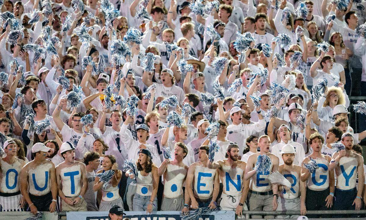 A group of Penn State students painted their chests “White Out … Energy” for the game against Illinois on Saturday, Sept. 28, 2024.