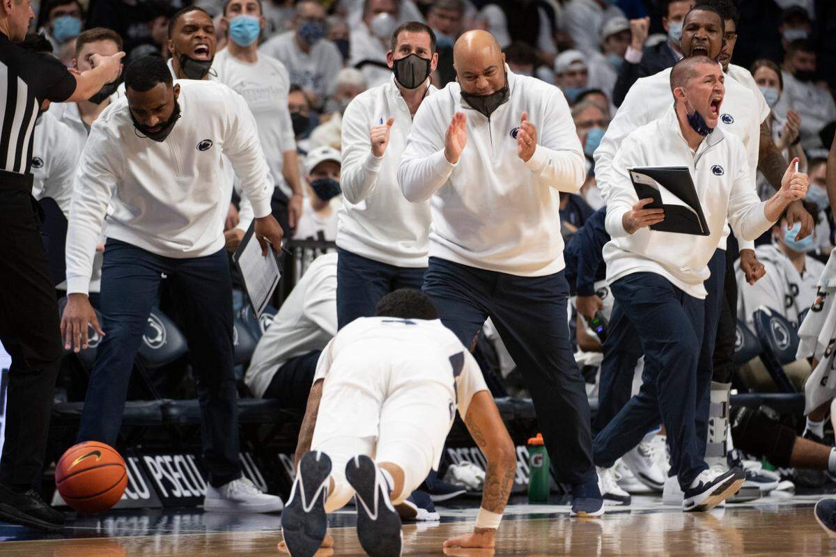Penn State head coach Micah Shrewsberry claps for Penn State guard Sam Sessoms (3) after he tips the ball out during an NCAA Basketball game between Penn State and Michigan at the Bryce Jordan Center on Tuesday, Feb. 8, 2022 in University Park, Pa.