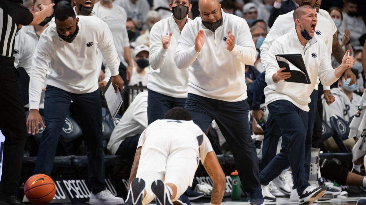 Penn State head coach Micah Shrewsberry claps for Penn State guard Sam Sessoms (3) after he tips the ball out during an NCAA Basketball game between Penn State and Michigan at the Bryce Jordan Center on Tuesday, Feb. 8, 2022 in University Park, Pa.