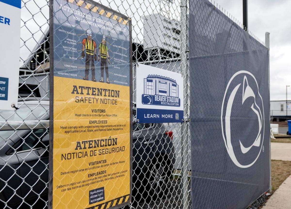 A sign about safety hangs on the fence around the job trailer for the Beaver Stadium construction project on Thursday, Dec. 19, 2024. The companies on the project, Barton Malow, Alexander and AECOME Hunt signed a partnership with OSHA.