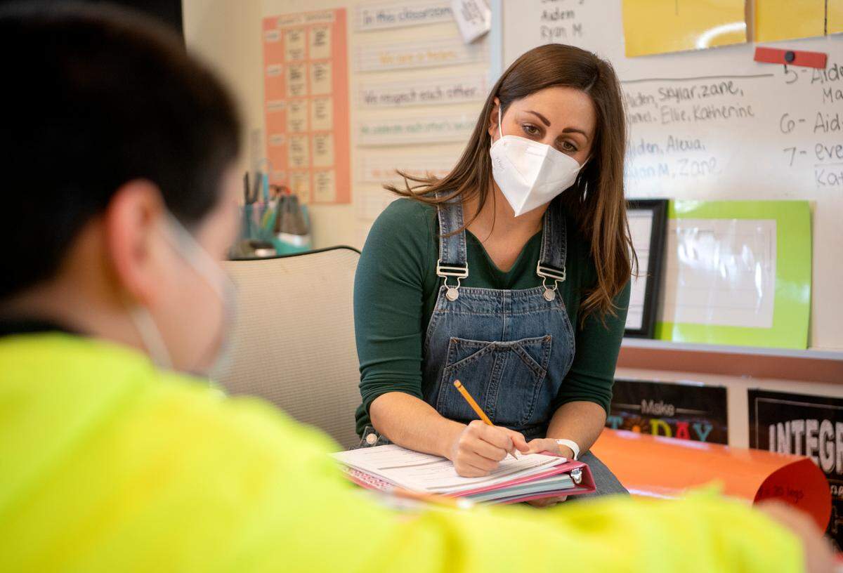 Andrea Snyder works with one of her third grade students at Mount Nittany Elementary on Friday.