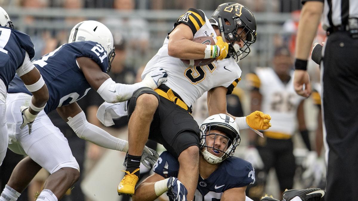 Penn State linebacker Jan Johnson trips up Appalachian State wide receiver Thomas Hennigan during the Saturday, Sept. 1, 2018 game at Beaver Stadium.