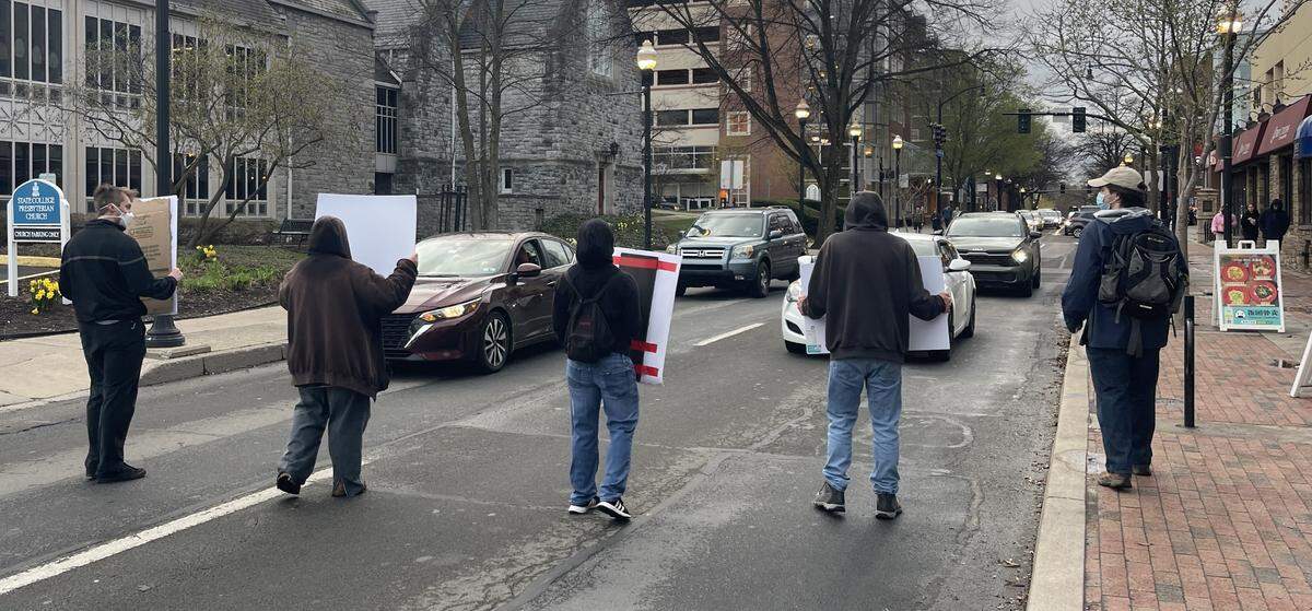 A group of about 50 Penn State student protesters marched in the streets in downtown State College on Tuesday evening after meeting at the Allen Street Gates.