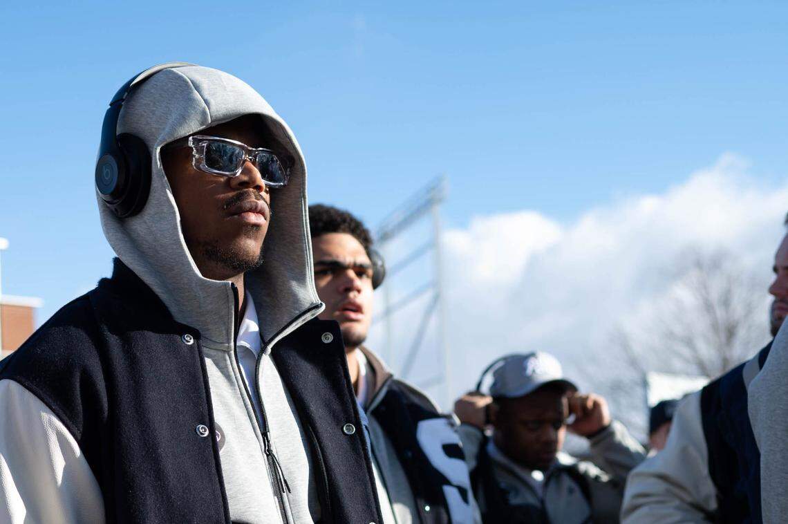Penn State defensive end Abdul Carter, left, walks into Beaver Stadium for the team’s College Football Playoff game two weekends ago.