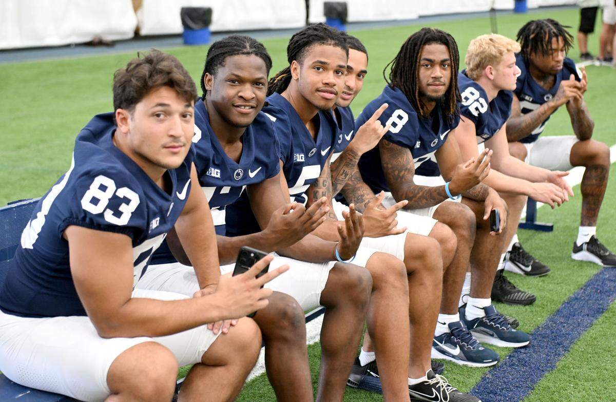 Members of the wide receivers room pose for a photo during media day on Saturday, Aug. 3, 2024.