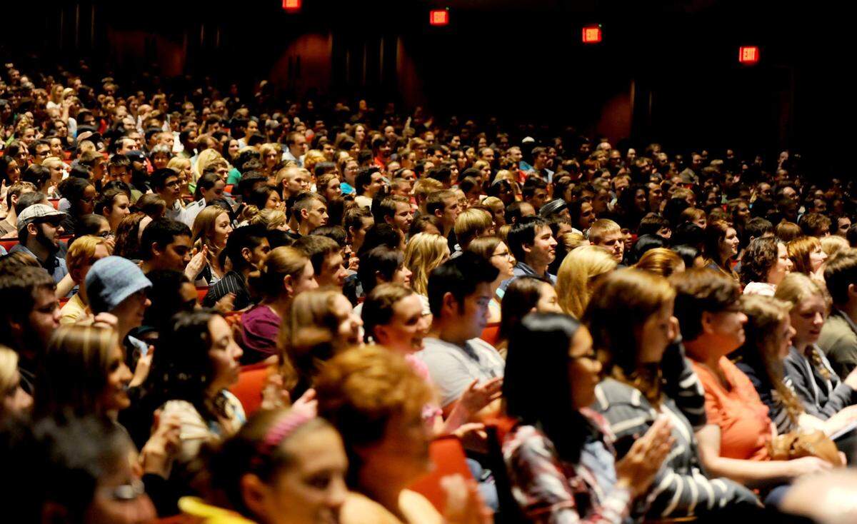 The crowd claps and laughs as Alton Brown, host of Food Network shows, “Iron Chef America” and “Good Eats,” makes a joke as part of the Distinguished Speakers Series in Eisenhower Auditorium on Wednesday, Sept. 28, 2011.