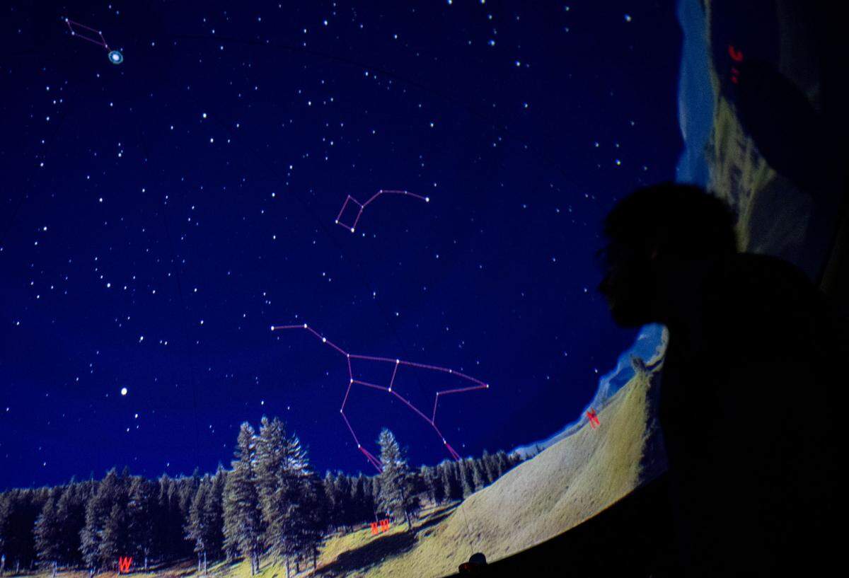 Penn State graduate student Christian Robles talks about constellations during a planetarium show at AstroFest on Wednesday, July 9, 2025.
