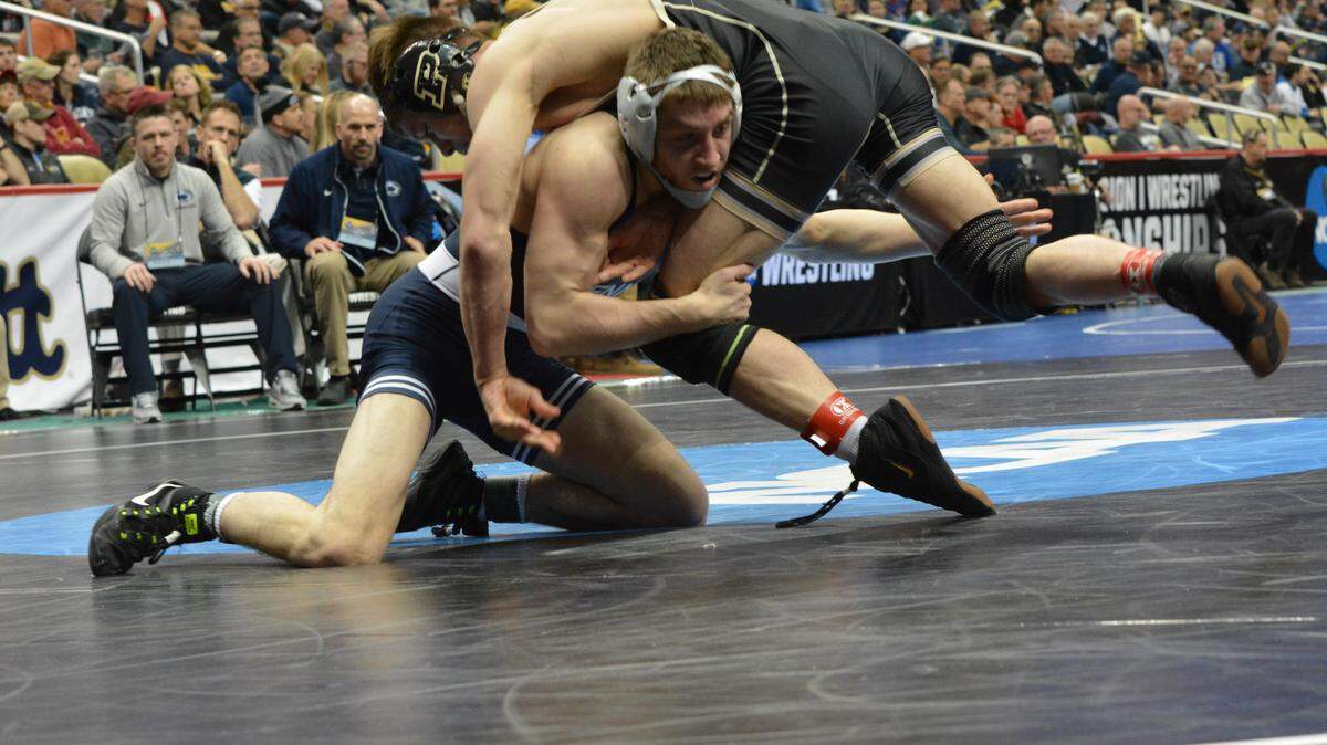 Penn State’s Nick Lee shoots in on a double leg on Purdue’s Nate Limmex in their 141-pound bout in the first round of the NCAA Wrestling Championships on Thursday at PPG Paints Arena in Pittsburgh. Lee won by fall in 1 minute and 47 seconds.