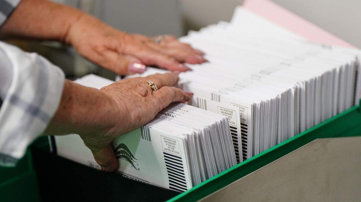 Mail-in ballots are sorted in Allentown, Pa. in 2022. A new bill would give counties more time to prep these ballots.