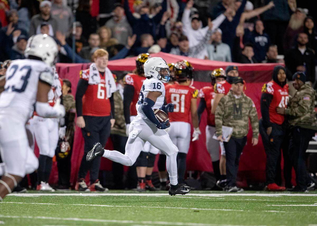 Penn State safety Ji’Ayir Brown intercepts the ball and runs it down the field for a touchdown during the game against Maryland on Saturday, Nov. 6, 2021.