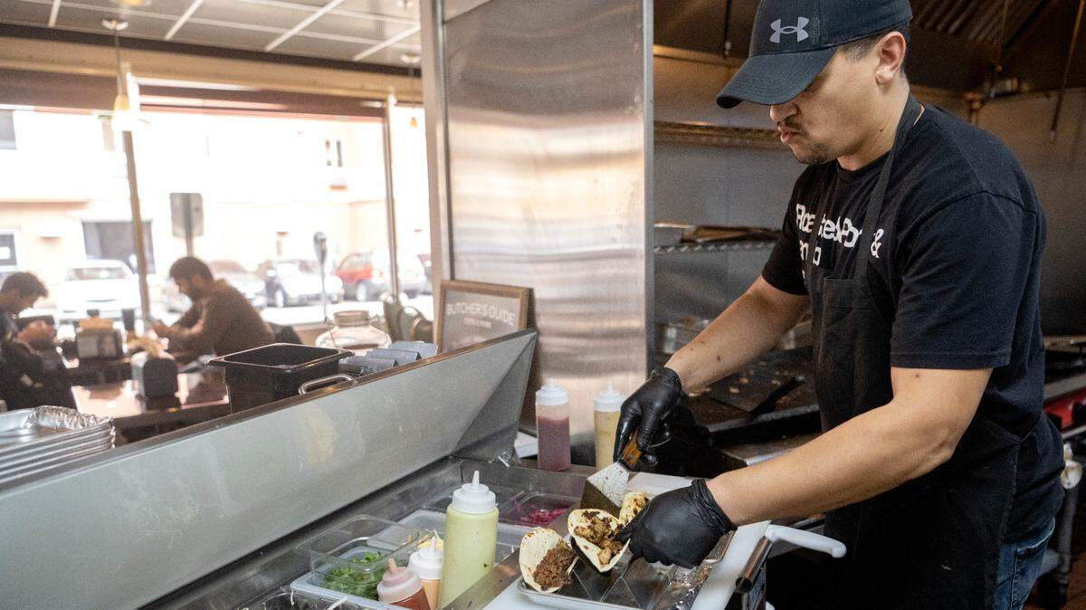 Shawn Carter makes an order of tacos at Carter’s Table on Wednesday, March 22, 2023.