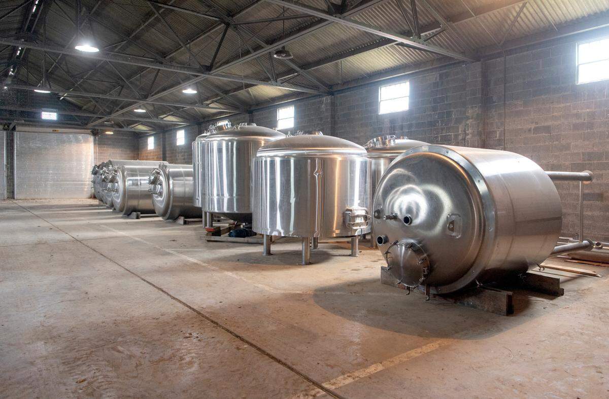 Brew tanks have been delivered to the largest building on the former Pennsylvania National Guard Armory property.