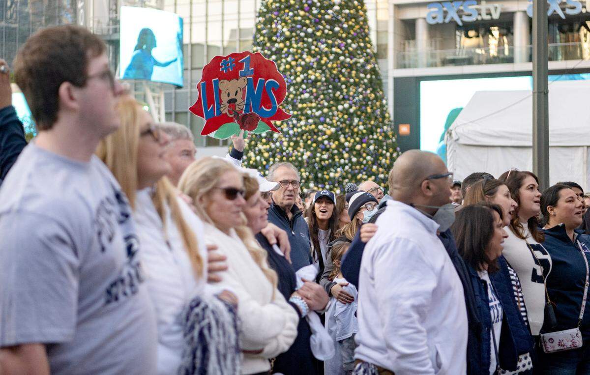 Penn State fans sing along to the alma matter during the pep rally hosted by the Penn State Alumni Association on Sunday, Jan. 1, 2023 at LA Live.