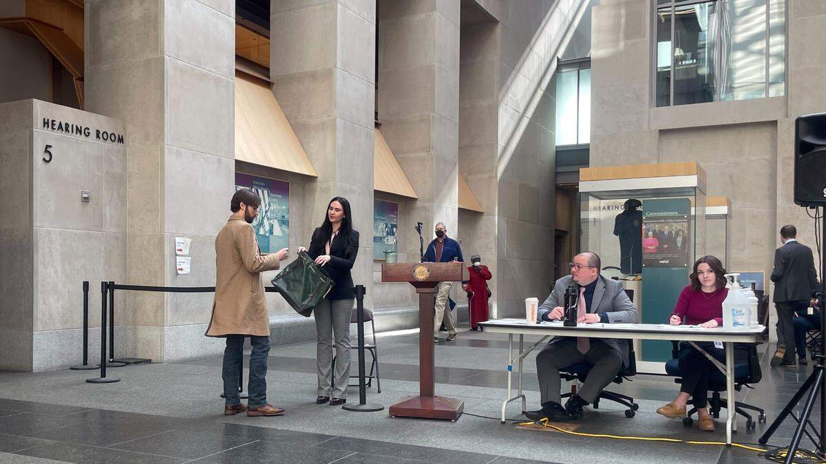 People participate in the Pennsylvania state House primary ballot lottery at the Keystone Building in Harrisburg.