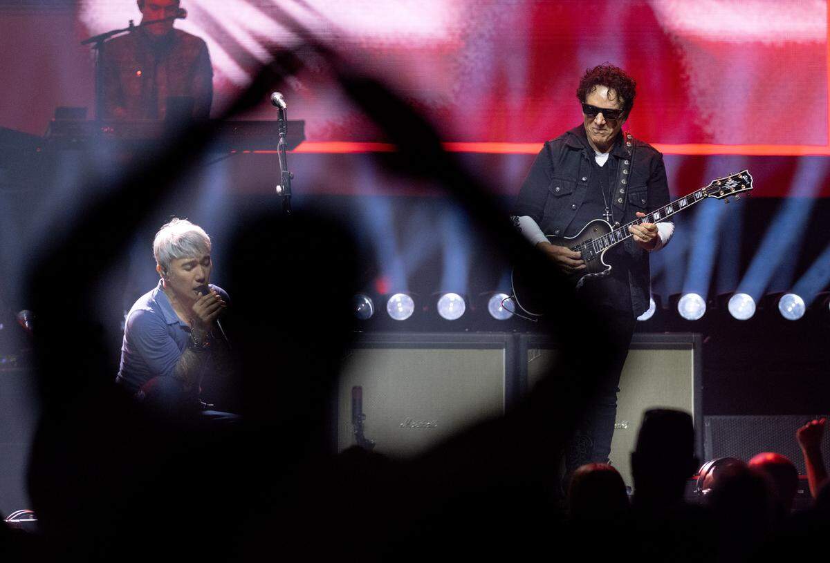 A fan claps along to Journey during their performance at the Bryce Jordan Center on Wednesday, May 27, 2026.  