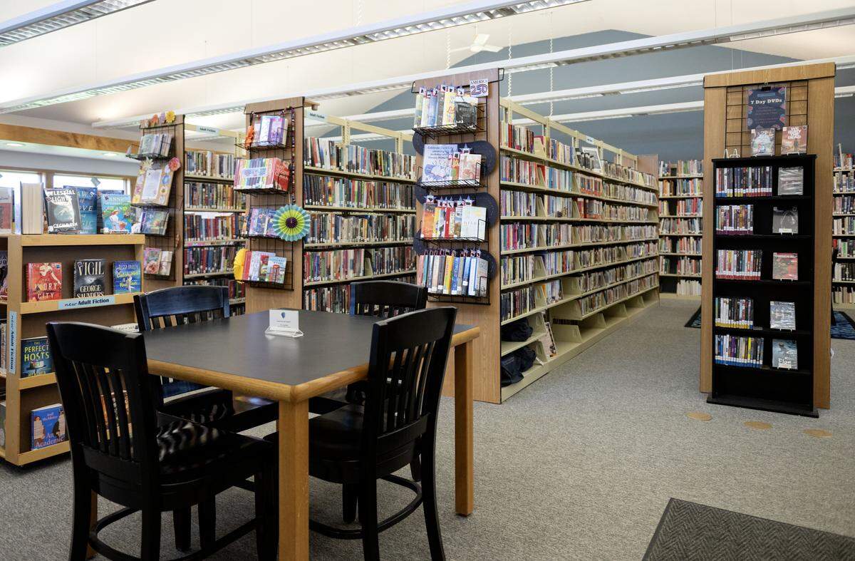 Table space among the shelves of books at the Centre Hall library on Tuesday, April 14, 2026.  
